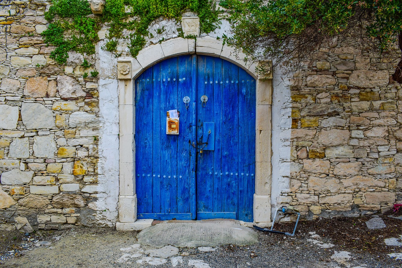 blue door with stone work